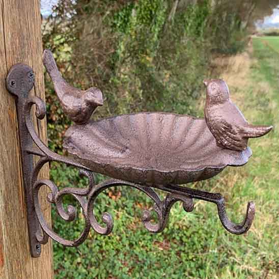 Wall bracket made of cast iron with a hook in the shape of a bird,..